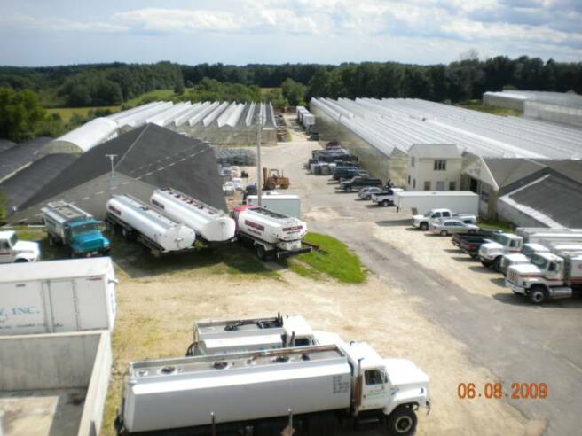 A view of the greenhouses from the oil storage tanks