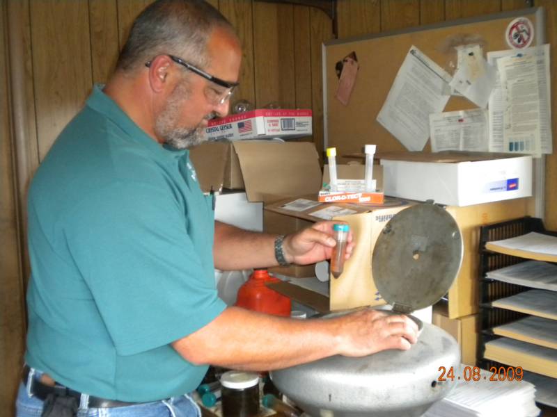 President Michael Gentuso inspecting a sample from an incoming load of used oil